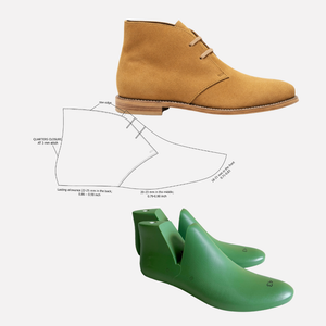 Tan suede chukka boot with green shoe trees and diagram on a white background